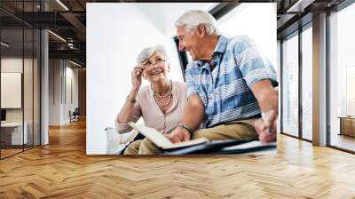 Senior couple, home and happy with writing on document in sofa for grocery or shopping list for household. People, planning and budgeting, saving and notebook for insurance and asset management Wall mural