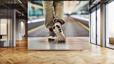 Shoes, train station and person waiting for travel or tourism on vacation, holiday or getaway. Sneakers, journey and closeup of passenger feet for public transport on sightseeing weekend trip in city Wall mural