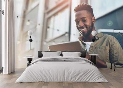 Smile, black man and tablet for internet in outdoor cafe with social media update and ebook app for reading. African male person, tech and online research with website for restaurant recommendations Wall mural