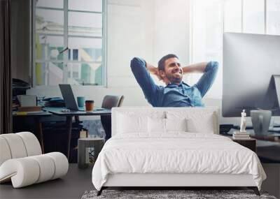 Smile, relax and happy man at office desk for stretching, productivity or done with project. Break, computer and employee with arms behind head for satisfied, achievement or deadline complete Wall mural