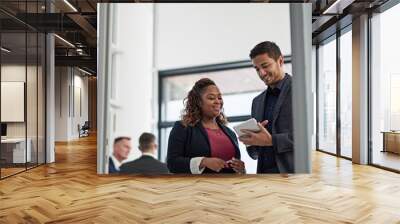 Smile, tablet and business people in office with advice, ideas or planning online report together. Man, woman and digital app in meeting for discussion, schedule or support in teamwork with low angle Wall mural