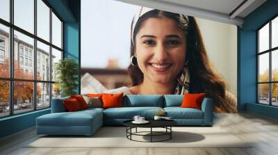 Sofa, happy and portrait of woman in home for resting, relaxing and comfortable on weekend. Living room, apartment and face of person on couch with free time, confidence and smile in morning Wall mural