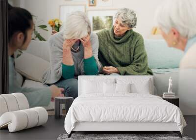 Sympathy, grief and elderly woman with family crying for loss, sadness or depression in living room. Mental health, emotions and senior female person comforting friend in sorrow for empathy at home. Wall mural