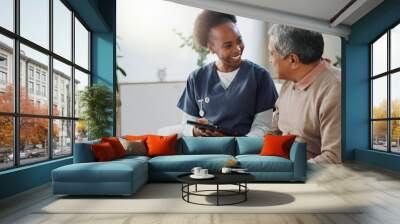 Tablet, healthcare and african nurse in home with senior man, internet and online help on sofa. Young caregiver, elderly person and technology for learning or telehealth and care in chronic illness Wall mural