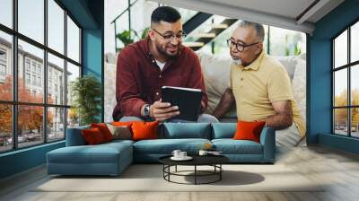 Tablet, teaching and man with senior father on sofa helping with communication, internet or email. Happy, bonding and elderly male person learning digital technology with son in living room at home. Wall mural