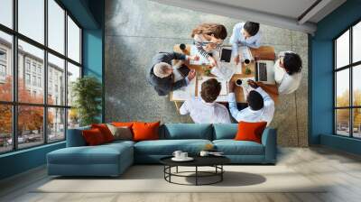 Top view, business people and ideas in meeting, teamwork and cooperation with collaboration. Group, staff and employees with paperwork, technology or portfolio with project, planning or brainstorming Wall mural