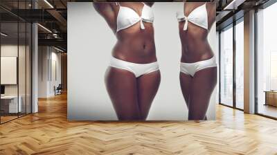 Transformation, weightloss and body of black woman on a gray background for diet, detox and wellness. Health, lose weight and stomach of isolated person for workout, exercise and fitness in studio Wall mural