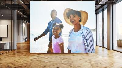 Waves, family and beach for walk, smile or ocean for relax on seaside holiday. Parents, child or sunlight for travel and vacation to Los Angeles, holding hands and love for mom or dad person together Wall mural