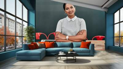 Woman, architect and portrait in office with arms crossed, pride or smile in career at construction agency. Person, happy and engineer at job for design, project or property at startup in Colombia Wall mural