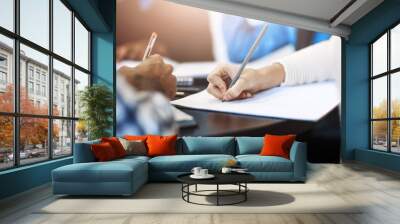 Writing, learning and hands of students in library for education, notes and mind map for creativity. People, books and studying at table for exam preparation, brainstorming and lesson in university Wall mural