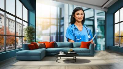 your health is fundamental to me. portrait of a young nurse standing in a hospital. Wall mural