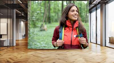 Beautiful, young woman hiking and enjoying in the nature Wall mural