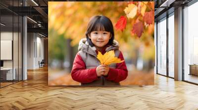 Child with autumn leaves, autumn natural backgroun Wall mural