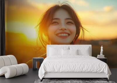 Happy asian woman smiling and enjoying outdoor during a beautiful sunset Wall mural