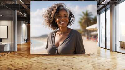 Happy beautiful attractive black mature female on the beach Wall mural