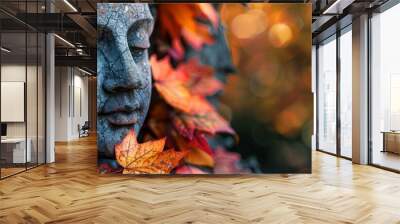 Autumn leaves on a garden statue Wall mural