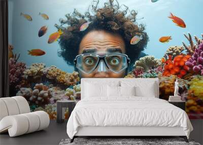 A man with an astonished expression, exploring a vibrant coral reef with diverse marine life such as tropical fish and colorful corals under crystal-clear waters against a plain white background. Wall mural