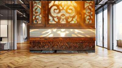 Vintage wooden podium with detailed carvings, highlighted by warm, natural light. Wall mural