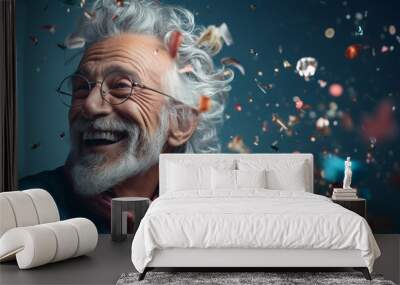 Happy laughing senior man grandad grandfather grandpa with glasses and falling confetti on teal blue background. Modern old guy with smile celebrating at party. Wall mural