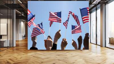 Group of People Waving American Flags over blue sky Wall mural