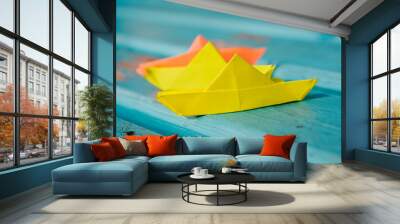 origami paper sailboat sailing on blue water, origami boat sailing in blue ocean , paper art style Wall mural