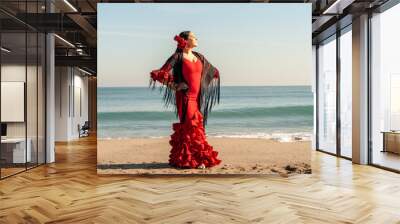 Young Spanish woman dancing flamenco on the beach Wall mural