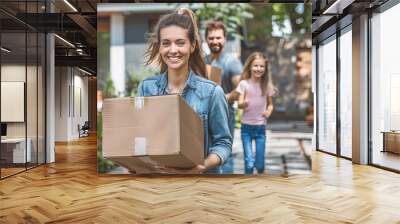 a young family collects (disassembles) boxes for moving to a new house, cardboard boxes, packing for moving Wall mural