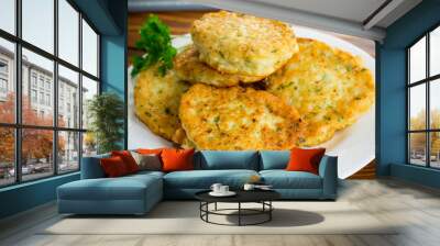 cooked fried potato cutlets with herbs Wall mural