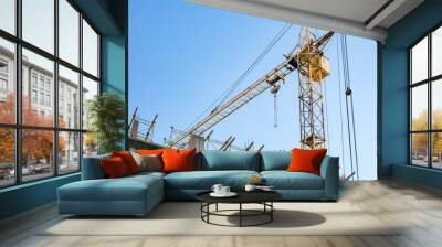 Building under construction and crane. Wall mural