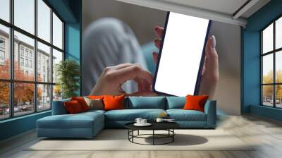 Close up Mock up white screen blank close up mobile phone in woman hands holding Back view Wall mural