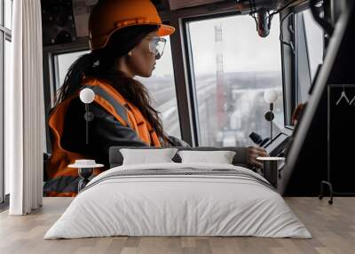 View from the cab of a construction tower crane, a female crane operator at a construction site, AI generated Generative AI Wall mural