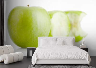 One whole and two bited green apples fruit on white Wall mural