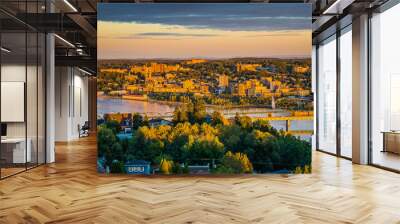 Colorful sunset and cloudy sky over the city of Chicoutimi in Quebec (Canada) Wall mural