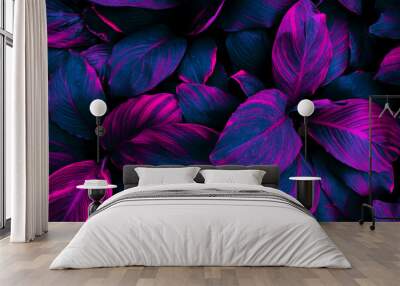 tropical leaf background, neon glow color toned. Wall mural