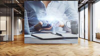 Double exposure of brain sketch hologram and woman holding and using a mobile device. Wall mural