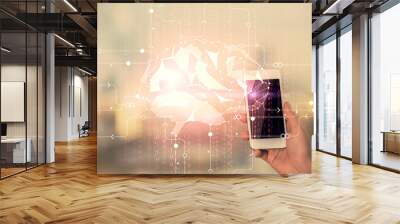 Double exposure of brain sketch hologram and woman holding and using a mobile device. Wall mural