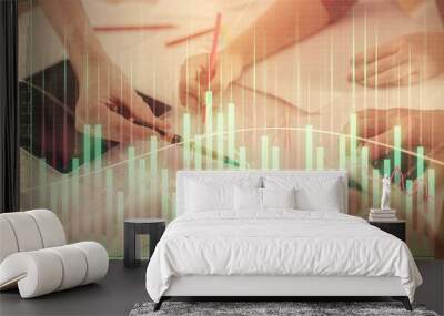 Double exposure of forex graph drawing and man and woman working together holding and using a mobile device. Trade concept. Wall mural