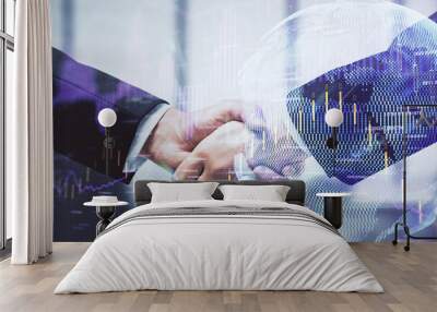 Double exposure of forex graph hologram and handshake of two men. Stock market concept. Wall mural