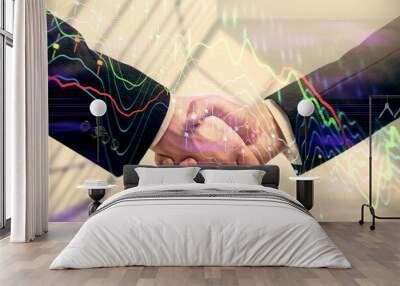 Double exposure of forex graph hologram and handshake of two men. Stock market concept. Wall mural