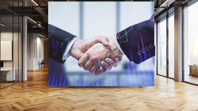 Double exposure of forex graph hologram and handshake of two men. Stock market concept. Wall mural