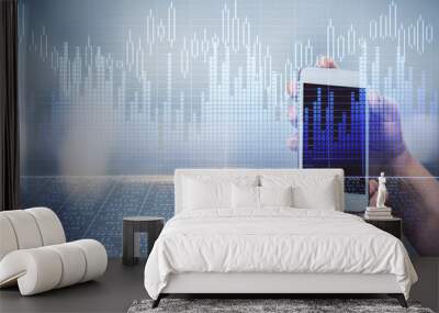 Double exposure of forex graph sketch hologram and woman holding and using a mobile device. Stock market concept. Wall mural