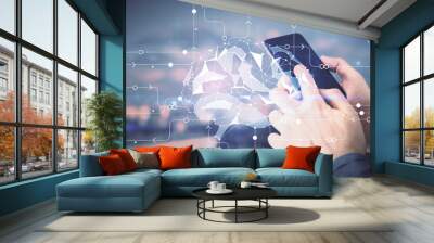 Double exposure of man's hand holding and using a digital device and brain hologram drawing. Data concept. Wall mural