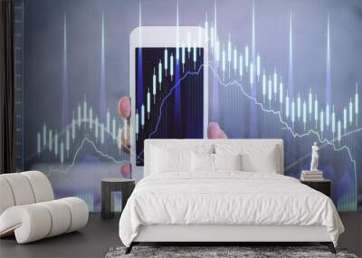 Double exposure of man's hands holding and using a digital device and forex graph drawing. Financial market concept. Wall mural