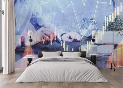 Double exposure of man's hands holding and using a phone and financial graph drawing. Analysis concept. Wall mural