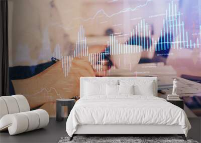 Double exposure of man's hands writing notes of stock market with forex graph. Wall mural