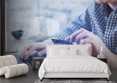 Double exposure of man hands holding a credit card and fingerprint drawing. Security in E-commerce concept. Wall mural