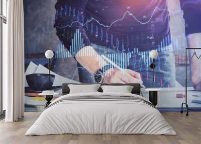 Double exposure of man writing on paper with forex graph. Wall mural