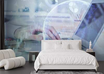 Double exposure of stock market graph with man working on laptop on background. Concept of financial analysis. Wall mural