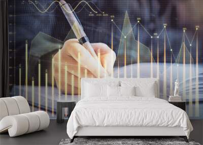 Double exposure of woman's hands making notes with forex graph hologram. Concept technical analysis. Wall mural