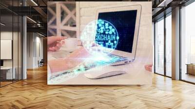 Double exposure of woman hands typing on computer and crypto market theme hologram drawing. Blockchain concept. Wall mural